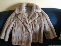 Front view of caramel mink fur short coat