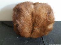 front view of brown fur muff