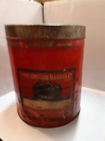 Front view of red McGreggor Harris Co. tin canister showing label