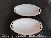 two white oval dishes shown top view