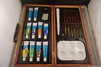 Open wooden case showing full contents