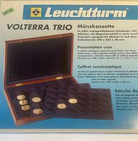 Box and product details showing the Leuchtturm Volterra Trio coin presentation case with specifications.
