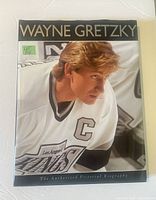 Front cover of the Wayne Gretzky authorized pictorial biography book with image of Gretzky in Los Angeles Kings uniform and title text.