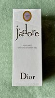 Front of sealed box showing J'adore Christian Dior branding, product name, and size.