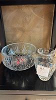 Photo showing a 7 inch Waterford crystal vase and a 9 inch crystal bowl side by side