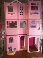 Front view of three-storey Barbie Dreamhouse exterior