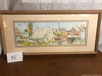 Full view of framed watercolor painting