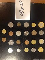 Full grid view of the 25 coins laid out