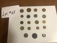 Overall view of 20 coins arranged on white board