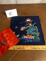 Both fabric pieces with ruler for scale