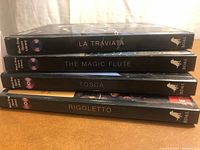 Spines showing four opera titles