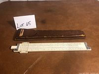 Slide rule and leather case full view