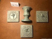 Overview of three plaques and wall pocket