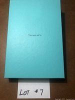 Closed Tiffany blue box with Tiffany & Co. logo