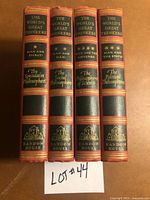 Spines of all four volumes showing titles, series, publisher logo