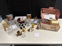 Photo showing all assorted teddy bear figurines including boxed and loose pieces