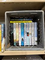 Top view of 12 books including multiple Danielle Steel titles and Mary Higgins Clark novels, all in hardcover and paperback format, spine titles visible.