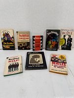 All eight Beatles books front covers visible