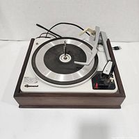 Top view of Garrard turntable showing platter, tonearm, spindle, control panel