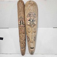 Front view of both carved masks