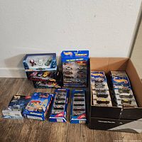 Group view of all packaged Hot Wheels cars, gift sets and board games