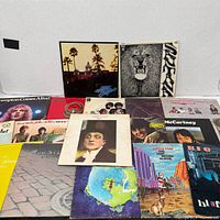 Group shot of rock LPs including Hotel California and Santana