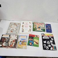 Group shot of all books, sealed VHS tapes, and workbooks