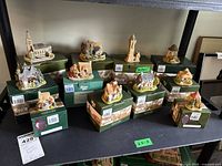 Main group shot showing eleven original boxed figures arranged in two rows