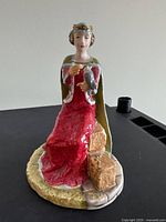 Front view of entire figurine on black background