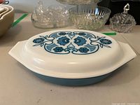 Side view of the Blue Horizon Pyrex serving dish showing overall shape, color and condition.