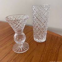 Both cut crystal vases side by side for scale and style overview
