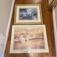 Two framed prints laid on floor showing entire lot
