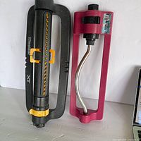 Two oscillating sprinklers side by side for full view