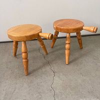 Two wooden milking stools full view