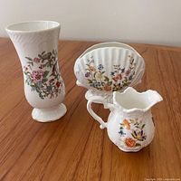 Overall view of three Aynsley bone china pieces