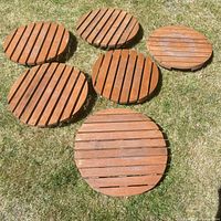 Six round cedar risers topside view on grass