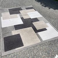 Full view of entire rug laid out, shows pattern and overall size