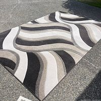 Full view of rug showing entire wave pattern