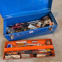 Blue toolbox open showing contents and orange removable tray