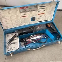 Open case showing Bosch 1632VS saw, blades, manuals