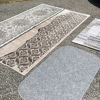 All four rugs laid out together for size and pattern view