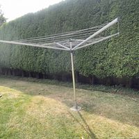 Clothesline fully extended in yard