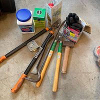 Overall view of all tools, fertilizers, gloves and accessories on floor