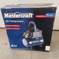 Front of sealed Mastercraft air compressor box