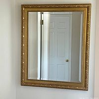 Full view of rectangular mirror mounted on wall