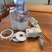 Overall view of food processor, hand mixer and attachments