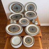 Overall set arranged on small table showing all pieces grouped