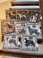 All eight Rustic Pet Art dog breed plaques displayed on stairs