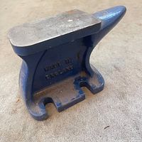 Side view of blue anvil showing size and horn