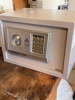 Front view showing keypad, knob and branding